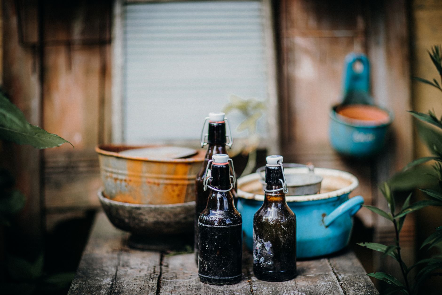 Artisan hot sauce bottles on a rustic wooden table
